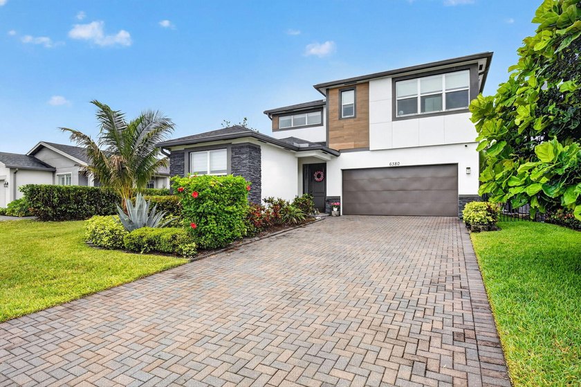 Welcome to this exceptional lakefront home, built in 2020 and - Beach Home for sale in West Palm Beach, Florida on Beachhouse.com