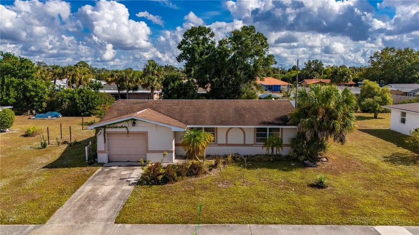 POTENTIAL AWAITS! This 2 bedroom, 2 bath home in Port Charlotte - Beach Home for sale in Port Charlotte, Florida on Beachhouse.com