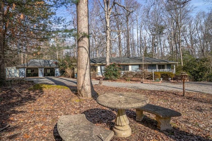 Tucked away amid a wooded lot sits this charming cottage which - Beach Home for sale in Lancaster, Virginia on Beachhouse.com