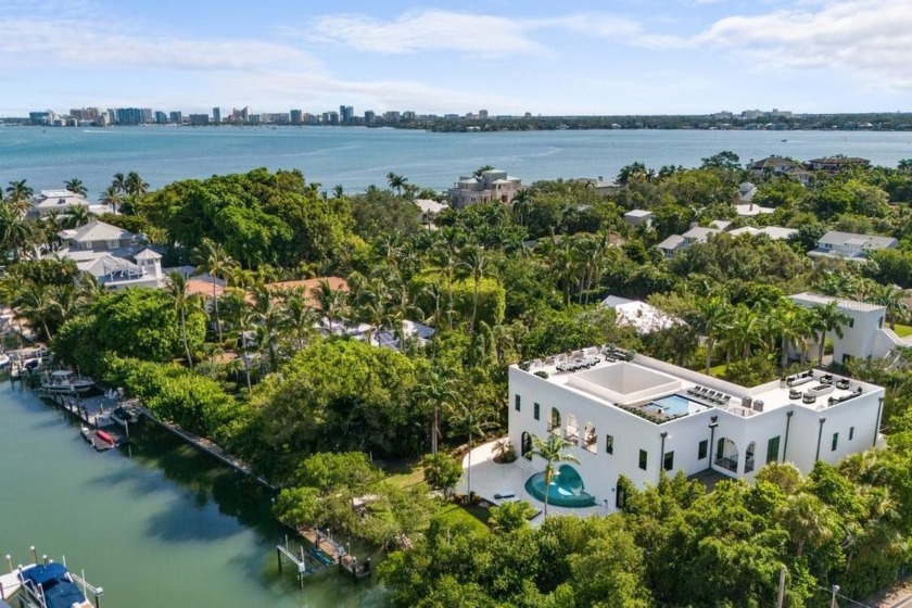 An elegant, private entrance shaded by regal palms and vibrant - Beach Home for sale in Sarasota, Florida on Beachhouse.com