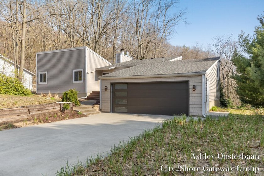 Just steps from Lake Michigan, this inviting wooded retreat - Beach Home for sale in West Olive, Michigan on Beachhouse.com
