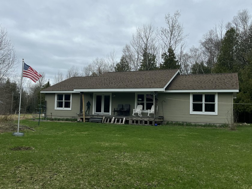 Lake Michigan beaches are steps away! This is a truly unique - Beach Home for sale in Charlevoix, Michigan on Beachhouse.com