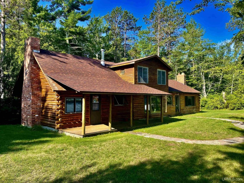 Discover the serene beauty of lakefront living with this - Beach Home for sale in Rapid River, Michigan on Beachhouse.com