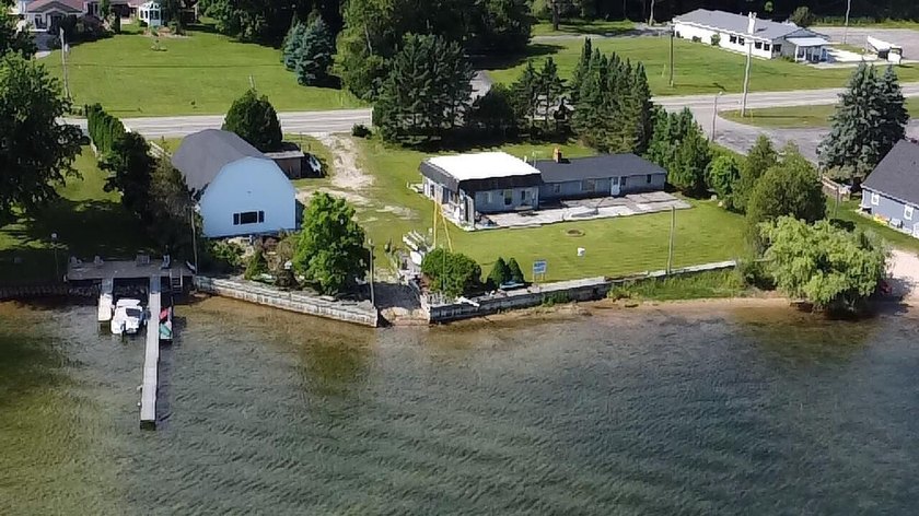 LIMITED TIME ONLY!!! Portage Lake with opportunities! 205 feet - Beach Home for sale in Onekama, Michigan on Beachhouse.com