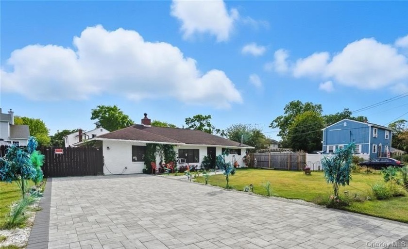 Step inside and Welcome to this spacious 4-bedroom home in the - Beach Home for sale in Shirley, New York on Beachhouse.com