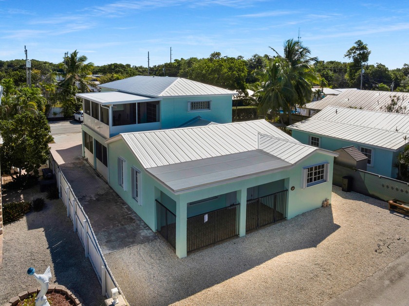 Spacious Key Largo home with a BRAND NEW METAL ROOF situated on - Beach Home for sale in Key Largo, Florida on Beachhouse.com