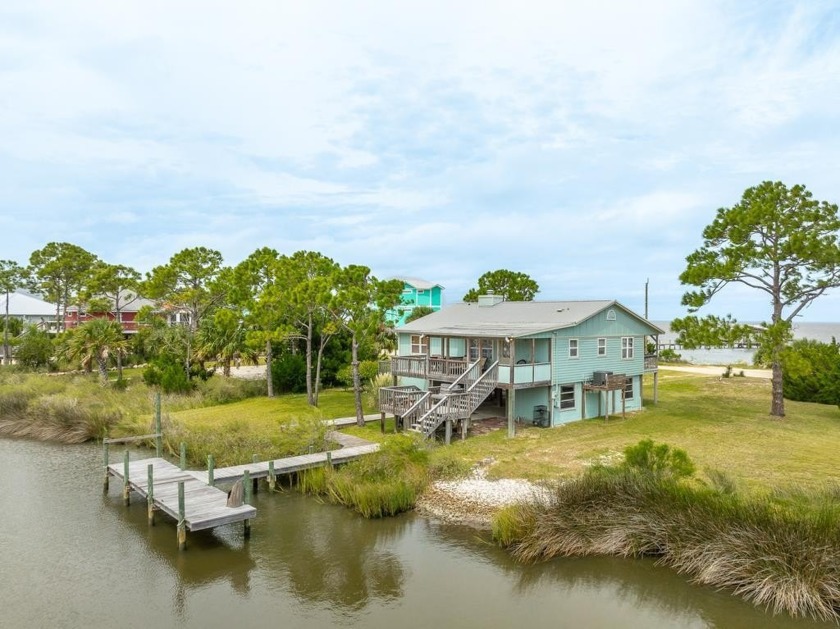 Coastal living at it's finest in this canal front cottage, the - Beach Home for sale in St. George Island, Florida on Beachhouse.com