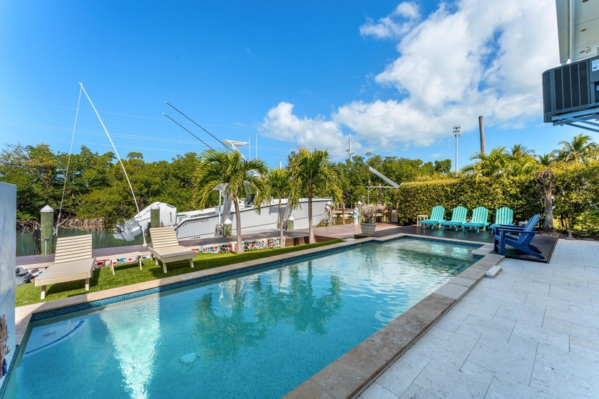 Artfully updated canal-front pool home on beloved Sunset Drive - Beach Home for sale in Lower Matecumbe Key, Florida on Beachhouse.com
