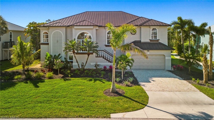 Expansive views of the lake and golf course from this furnished - Beach Home for sale in Sanibel, Florida on Beachhouse.com