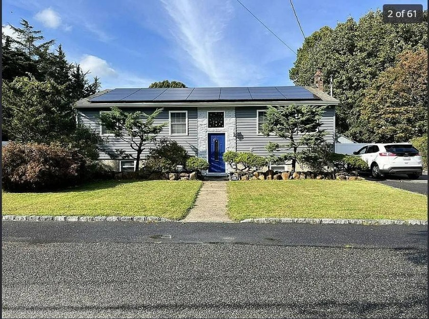 TOTALLY UPDATED SPACIOUS 2652 SQ. FT. HI RANCH WITH NEW SOLAR - Beach Home for sale in Wading River, New York on Beachhouse.com