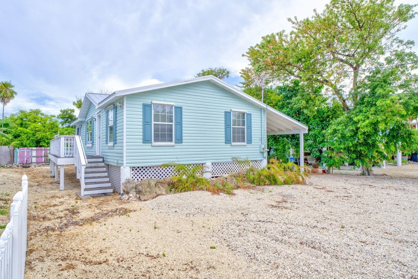 Above flood and full of character, this three-bedroom, two-bath - Beach Home for sale in Marathon, Florida on Beachhouse.com