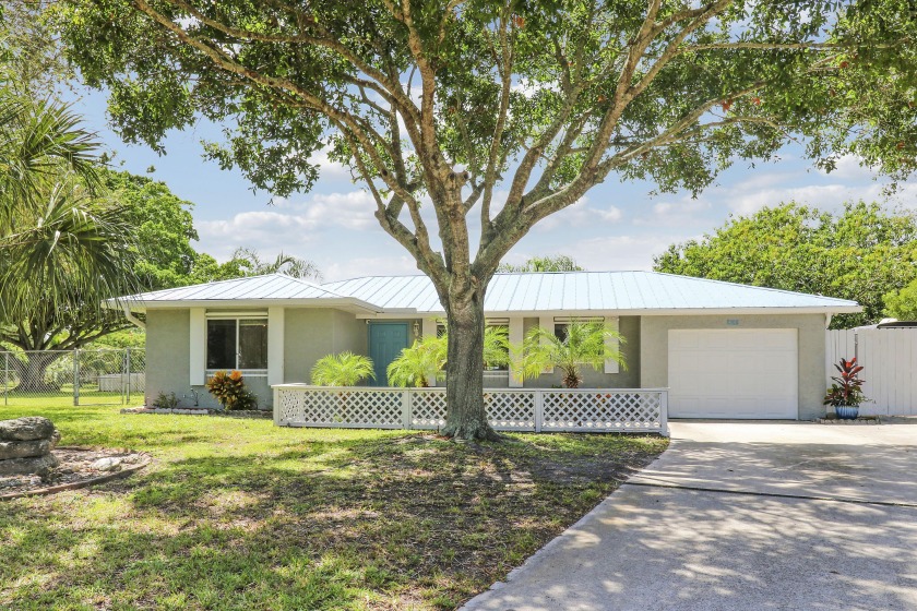 Nestled in a quiet cul-de-sac on nearly half an acre, this - Beach Home for sale in Port Saint Lucie, Florida on Beachhouse.com