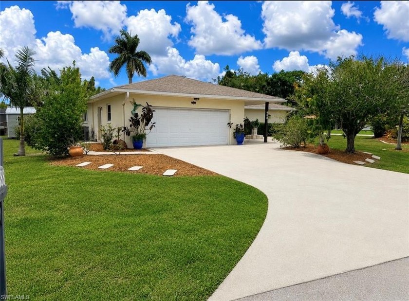 Welcome to this inviting Florida retreat, set on a corner lot - Beach Home for sale in Bonita Springs, Florida on Beachhouse.com