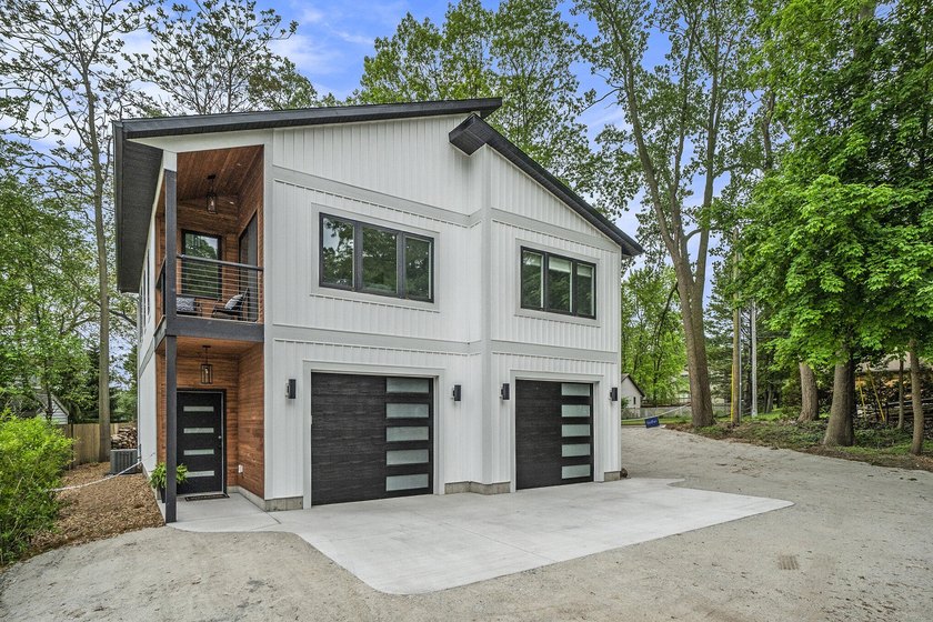 Welcome to this stunning 4-bedroom, 3-bathroom contemporary home - Beach Home for sale in Muskegon, Michigan on Beachhouse.com
