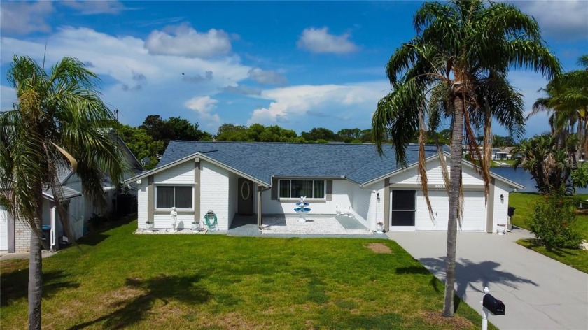 Welcome to this beautifully renovated 3 bedroom, 2 bath, 2-car - Beach Home for sale in Holiday, Florida on Beachhouse.com