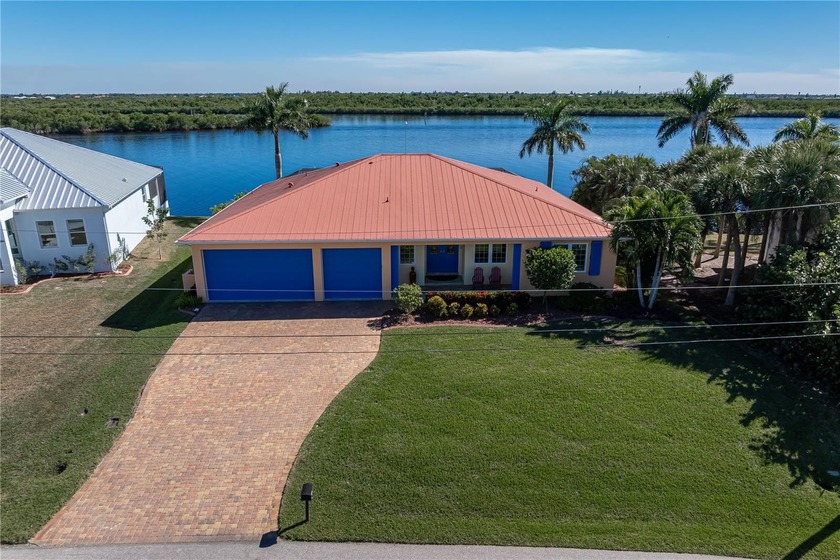 PEACE RIVER WATERFRONT LIVING W/108FT SEAWALL, LAP POOL, SOLAR - Beach Home for sale in Punta Gorda, Florida on Beachhouse.com