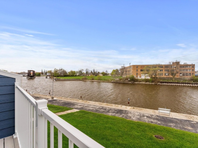 Discover this beautifully renovated second-floor condo featuring - Beach Condo for sale in Manitowoc, Wisconsin on Beachhouse.com