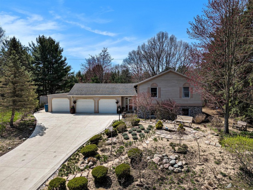 Welcome to this beautifully maintained 7-bedroom, 2.5-bathroom - Beach Home for sale in Spring Lake, Michigan on Beachhouse.com
