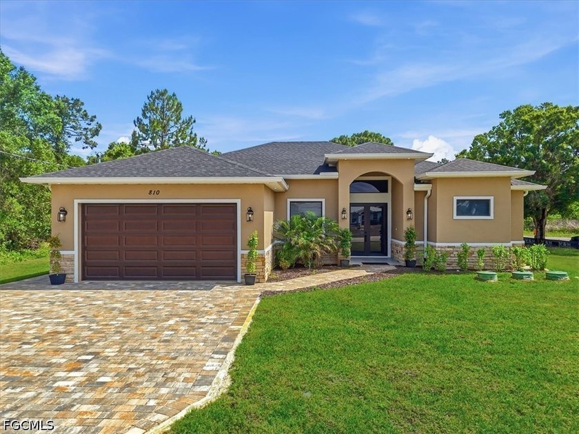 This beautifully crafted new construction home sits on an - Beach Home for sale in Lehigh Acres, Florida on Beachhouse.com