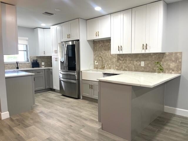 Beautifully renovated corner unit featuring a modern kitchen - Beach Condo for sale in West Palm Beach, Florida on Beachhouse.com