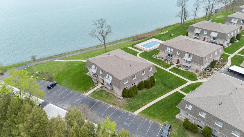 Rare third floor condo perched directly on the shores of Lake - Beach Condo for sale in Saint Joseph, Michigan on Beachhouse.com