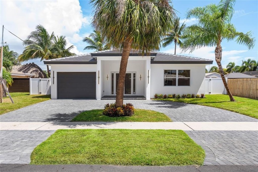 Nestled in the heart of Garden Isles, this new construction - Beach Home for sale in Pompano Beach, Florida on Beachhouse.com