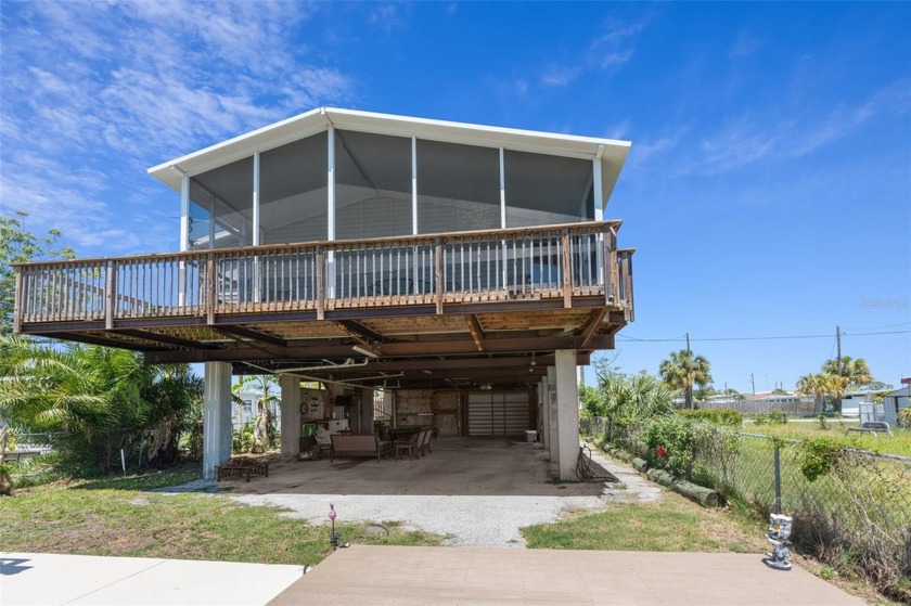 Welcome to waterfront living in this elevated manufactured home - Beach Home for sale in Hudson, Florida on Beachhouse.com
