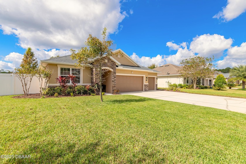Experience tranquil lakefront living in the desirable Deer Creek - Beach Home for sale in Ormond Beach, Florida on Beachhouse.com