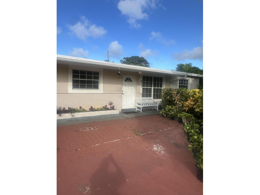 Welcome to this 4-bedroom, 2-bathroom home in the heart of West - Beach Home for sale in West Palm Beach, Florida on Beachhouse.com