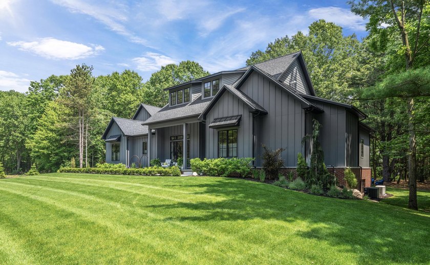 Behind the private gates of Gaslight Estates sits this - Beach Home for sale in Saugatuck, Michigan on Beachhouse.com
