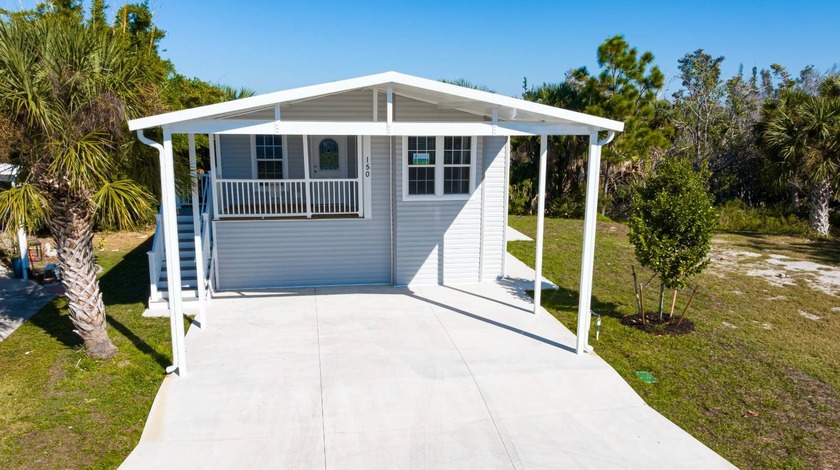 PRICE REDUCED!!    Brand New 2025 Jacobsen!! When you pull up to - Beach Home for sale in Punta Gorda, Florida on Beachhouse.com