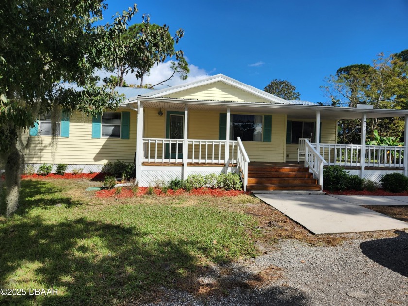 Approximately 3 Acres of Country Charm! A welcoming wrap-around - Beach Home for sale in Daytona Beach, Florida on Beachhouse.com