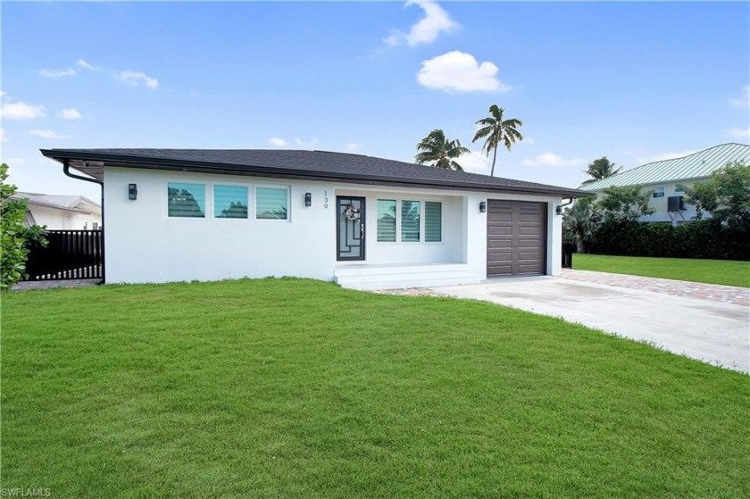 Beautifully remodeled in 2023, this stunning Isles of Capri home - Beach Home for sale in Naples, Florida on Beachhouse.com