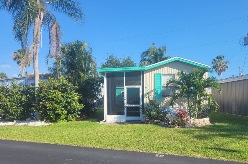 This charming small cottage-style manufactured home sits at the - Beach Home for sale in Bokeelia, Florida on Beachhouse.com
