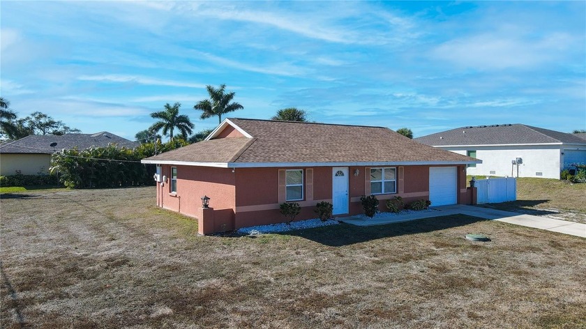 Welcome to this charming 2-bedroom, 1.5-bathroom home with an - Beach Home for sale in Port Charlotte, Florida on Beachhouse.com