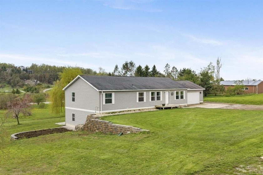This 4-bedroom, 2-bathroom Petoskey ranch perfectly balances a - Beach Home for sale in Petoskey, Michigan on Beachhouse.com
