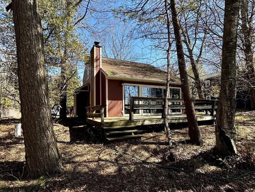 First time on the market since 1985. A classic Lake Michigan - Beach Home for sale in Mears, Michigan on Beachhouse.com