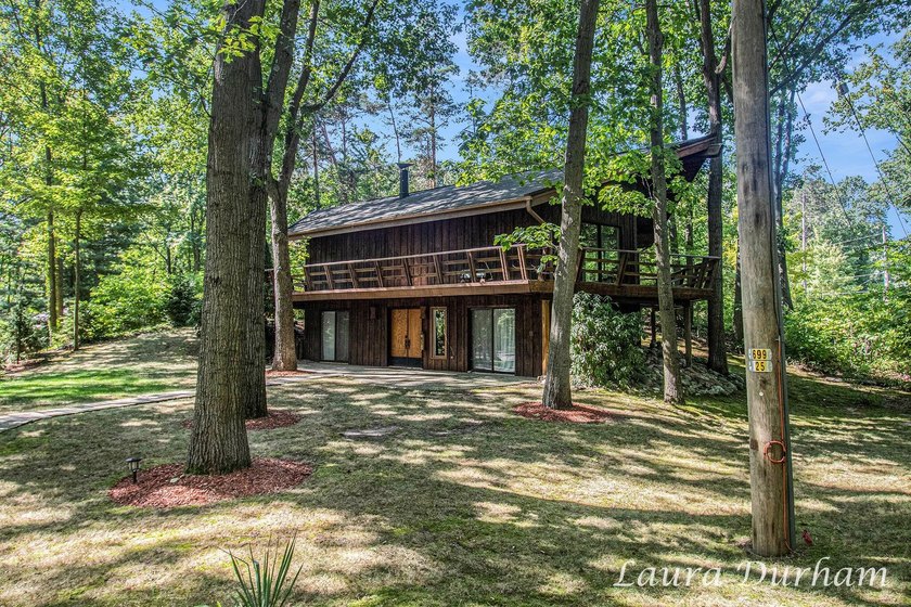 A truly distinctive offering, this sophisticated retreat has - Beach Home for sale in Holland, Michigan on Beachhouse.com