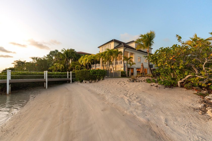 Tucked behind swaying palms and lush tropical landscaping, this - Beach Home for sale in Shark Key, Florida on Beachhouse.com