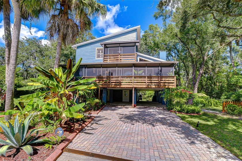 Set on a beautifully landscaped .32-acre lot, this 3-bedroom, 2 - Beach Home for sale in Tampa, Florida on Beachhouse.com