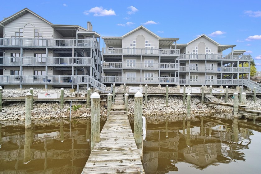 Enjoy waterfront living in this 2-bedroom, 2 full bath condo on - Beach Condo for sale in Manistee, Michigan on Beachhouse.com