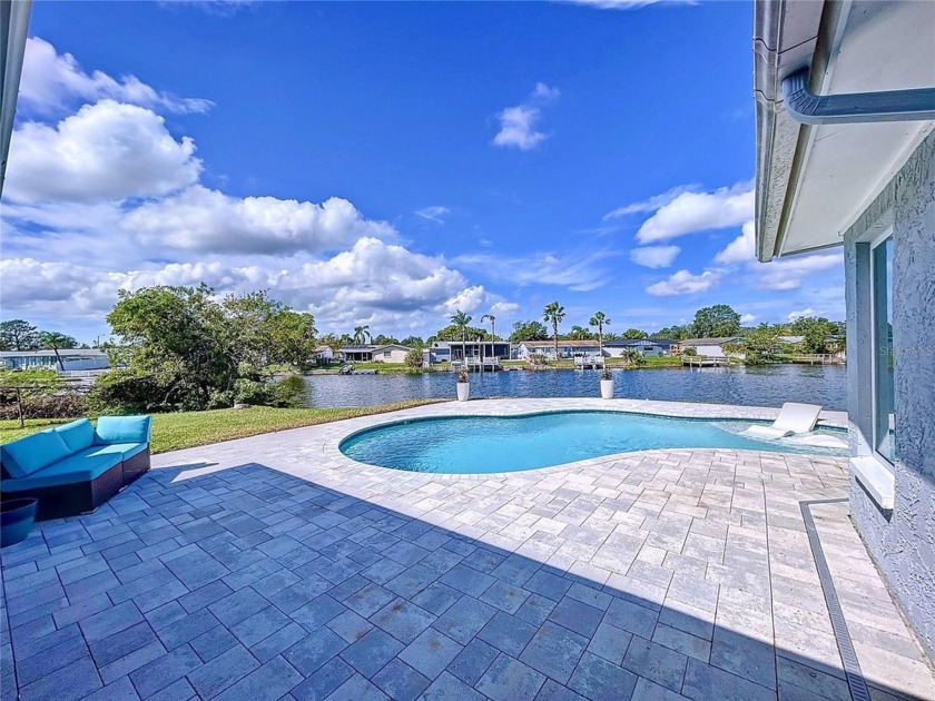 Experience Luxurious Waterfront Living in Florida! This - Beach Home for sale in Holiday, Florida on Beachhouse.com