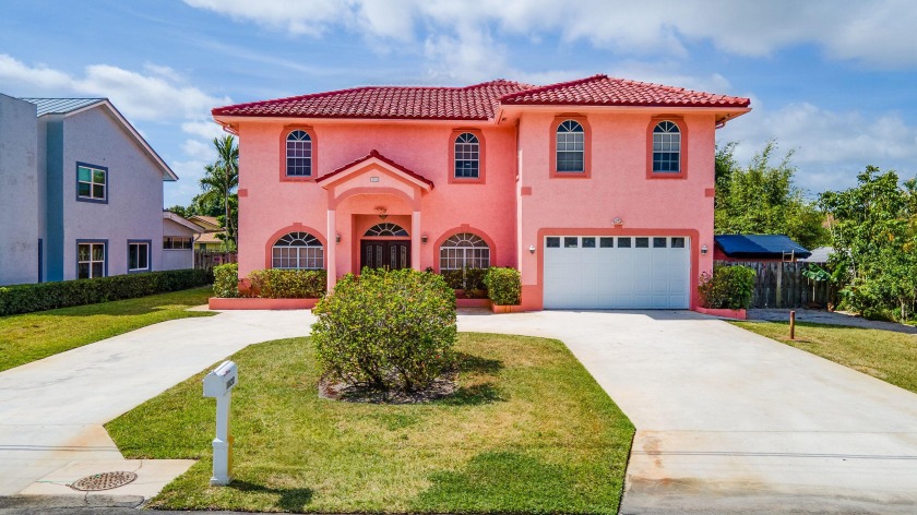 Welcome to 1820 Carambola Road, located in the prestigious Lake - Beach Home for sale in Lake Clarke Shores, Florida on Beachhouse.com