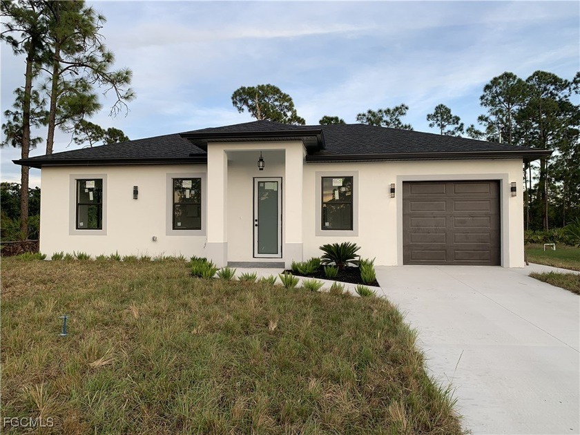 Don't miss this brand-new construction home located just minutes - Beach Home for sale in Lehigh Acres, Florida on Beachhouse.com