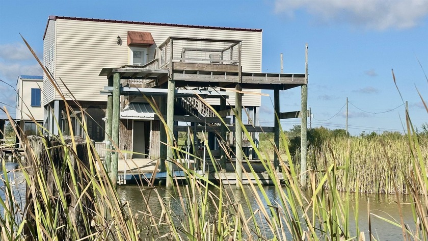 CAMP IS ON THE WATER ON BAYOU DULARGE WITH COVERED BOAT LIFT - Beach Condo for sale in Theriot, Louisiana on Beachhouse.com