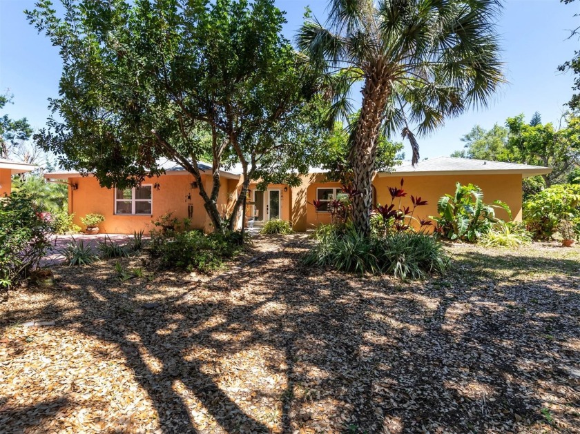This beautifully updated 3 bedroom, 2 bathroom home is situated - Beach Home for sale in Nokomis, Florida on Beachhouse.com