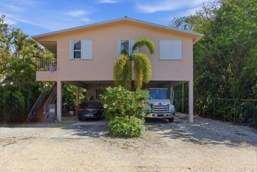 Discover your tropical retreat in Key Largo! This solid and - Beach Home for sale in Key Largo, Florida on Beachhouse.com