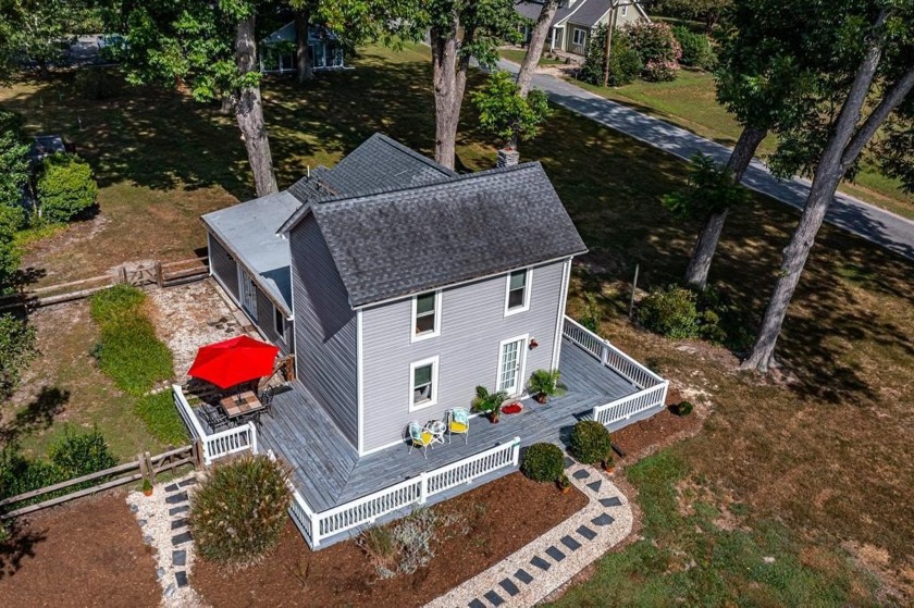 This Salt Box-inspired beauty, echoes the cozy charm of early - Beach Home for sale in Irvington, Virginia on Beachhouse.com