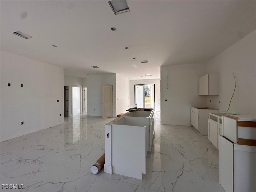 This brand-new 4-bedroom, 2-bath home features an open floor - Beach Home for sale in Lehigh Acres, Florida on Beachhouse.com