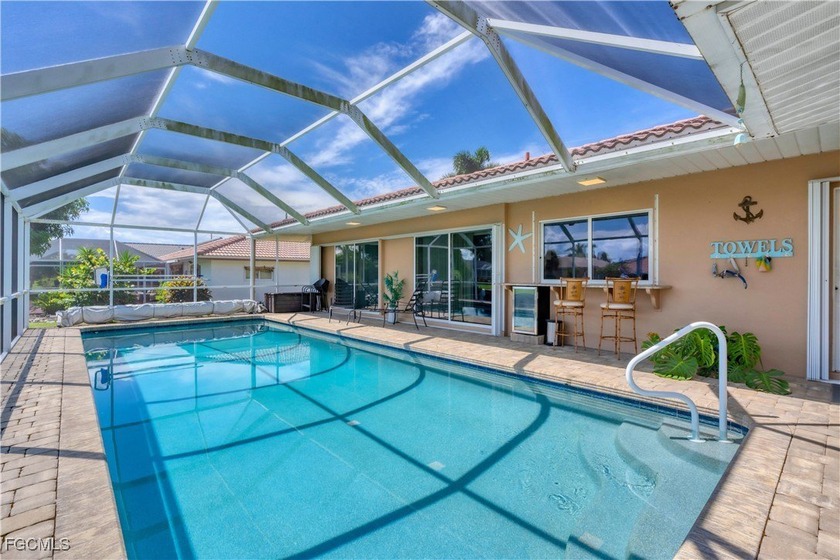 This immaculate waterfront canal pool home with gulf-access is - Beach Home for sale in Punta Gorda, Florida on Beachhouse.com